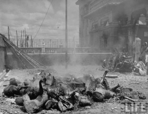 Corpses lying among pieces of wood in preparation for cremation after bloody rioting between Hindus and Muslims Calcutta (Kolkata) 1946